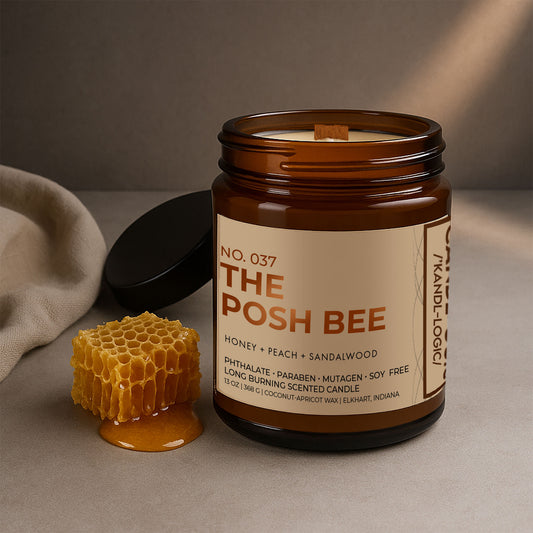 No. 037 The Posh Bee candle in amber glass jar with black lid, honey peach and sandalwood fragrance.